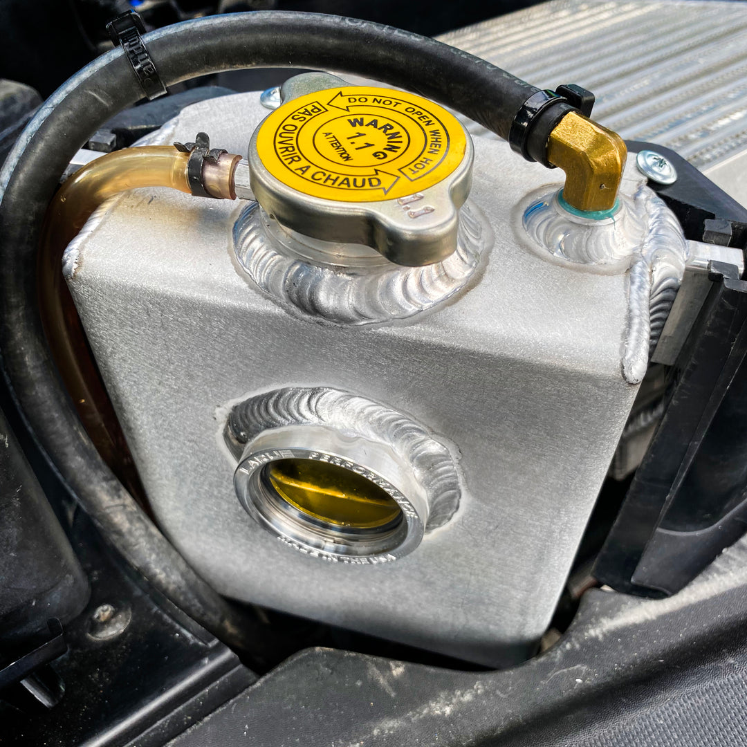 Replace your plastic Stock Coolant Tank with our durable Aluminum Coolant Tank. LaRue Performance's aftermarket Aluminum Coolant reservoir is well made with billet mounting brackets and a strong billet filler neck, making it reliable and eliminating all the weak points.