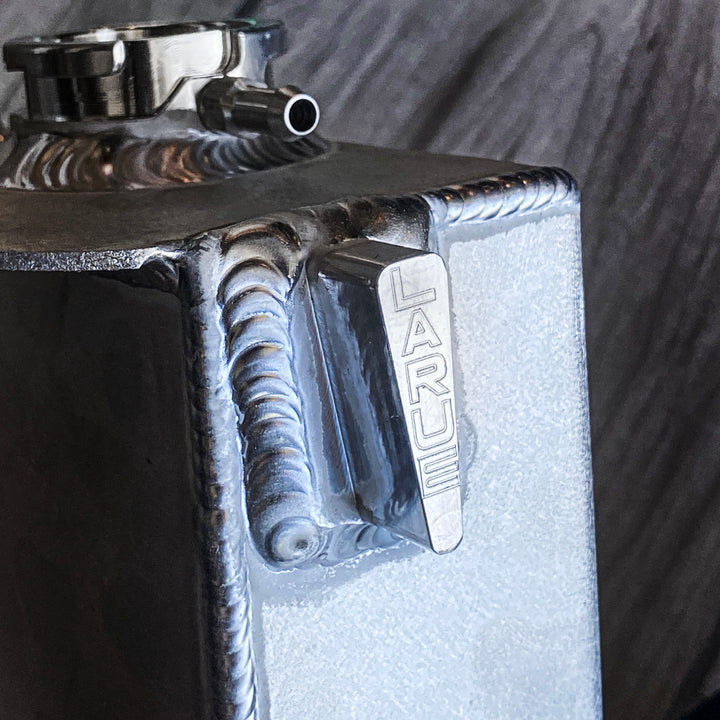 Replace your plastic Stock Coolant Tank with our durable Aluminum Coolant Tank. LaRue Performance's aftermarket Aluminum Coolant reservoir is well made with billet mounting brackets and a strong billet filler neck, making it reliable and eliminating all the weak points.