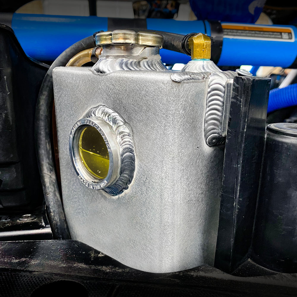 Replace your plastic Stock Coolant Tank with our durable Aluminum Coolant Tank. LaRue Performance's aftermarket Aluminum Coolant reservoir is well made with billet mounting brackets and a strong billet filler neck, making it reliable and eliminating all the weak points.