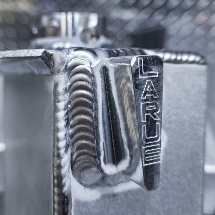 Replace your plastic Stock Coolant Tank with our durable Aluminum Coolant Tank. LaRue Performance's aftermarket Aluminum Coolant reservoir is well made with billet mounting brackets and a strong billet filler neck, making it reliable and eliminating all the weak points.